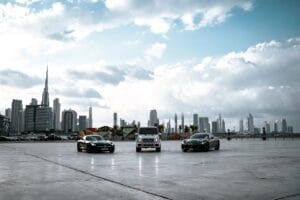 Luxury car hire options in Dubai with city skyline in background 