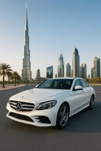 white luxury Mercedes parked near Burj Khalifa on a clean Dubai road